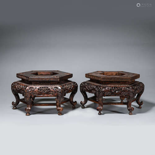 A pair of rosewood pedestals