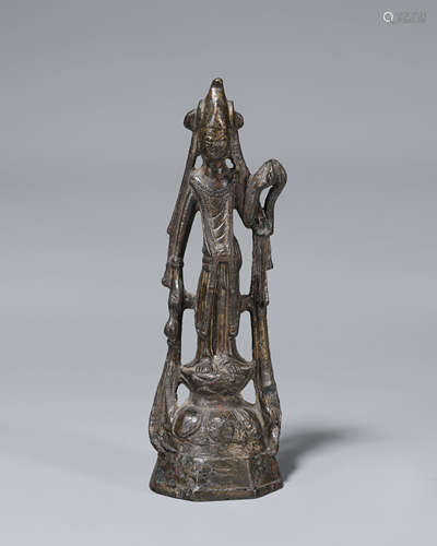 A copper Guanyin statue