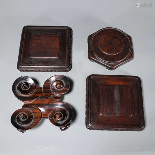 A group of 4 wood pedestals