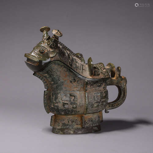 A taotie patterned goat head bronze pot