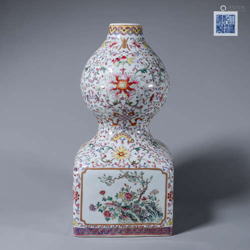 A famille rose interlocking flower and bird porcelain gourd-...