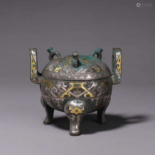 A beast face patterned three-legged bronze pot