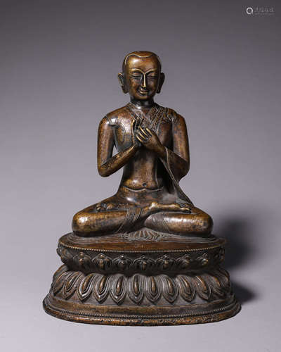 A copper buddha statue