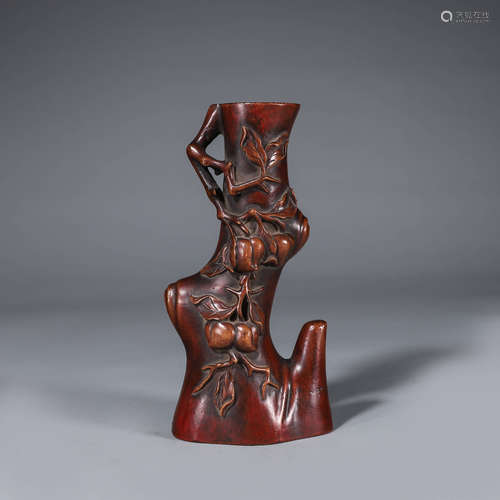 A boxwood carved flower holder