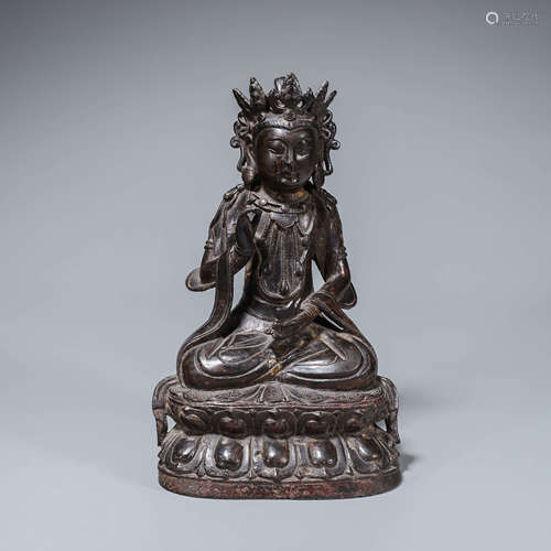 A copper buddha statue