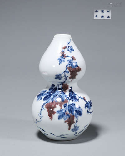 A blue and white porcelain gourd-shaped vase