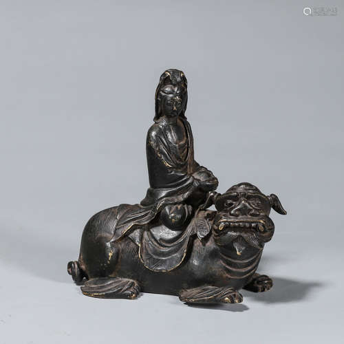 A copper Guanyin statue