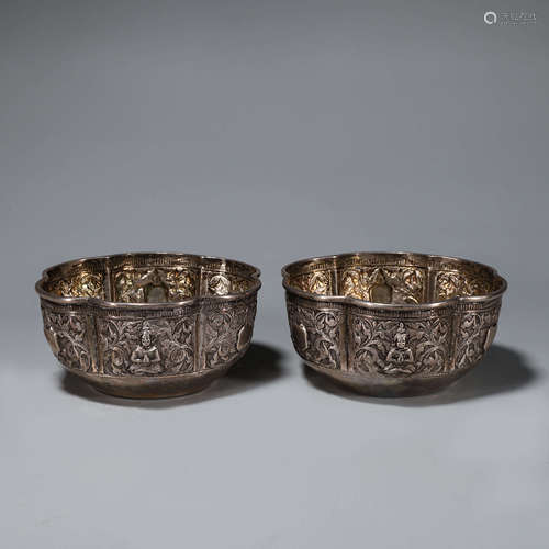 A pair of plum blossom shaped silver bowls