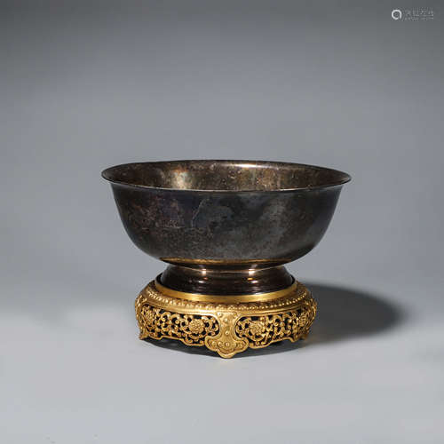 A silver bowl with gilding copper pedestal