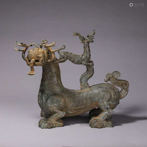 A bronze deer and dragon ornament