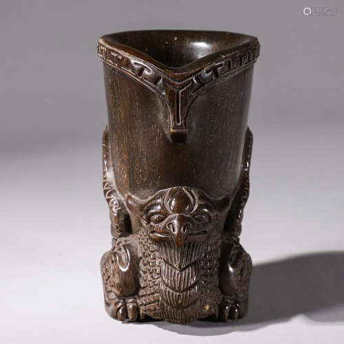 A horn carved phoenix jue cup