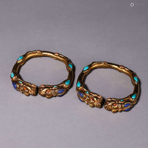 A pair of dragon head gilding silver gem-inlaid bracelets