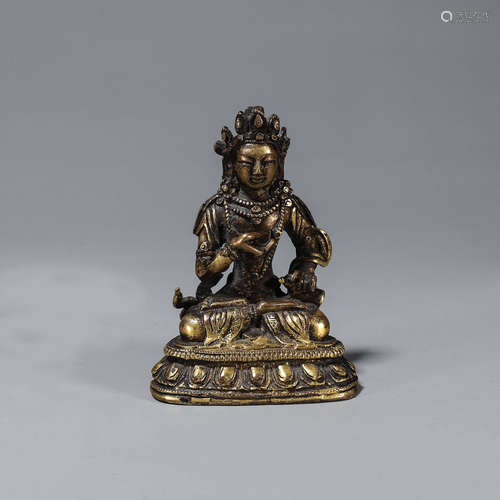 A copper buddha statue