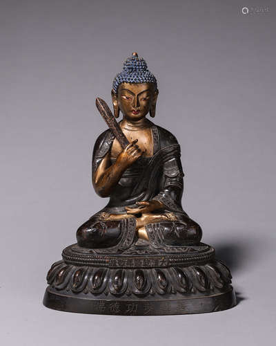 A copper buddha statue