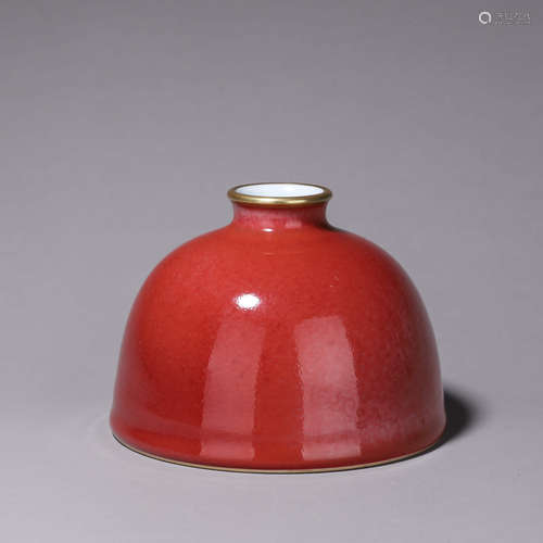 A red glazed porcelain zun