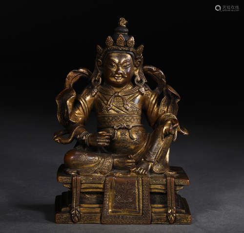 A MING DYNASTY GILT BRONZE MAMMON STATUE