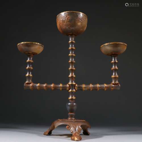 A LIAO DYNASTY AGATE GILDING CANDLESTICK