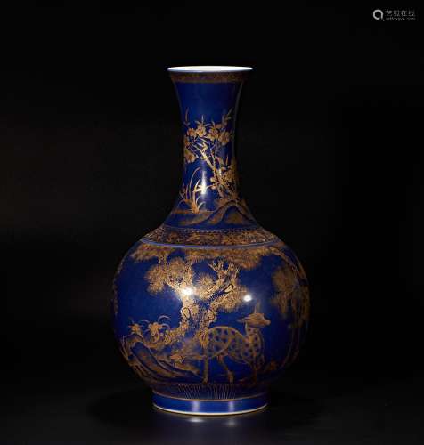 A vase with golden dragon pattern painted on blue