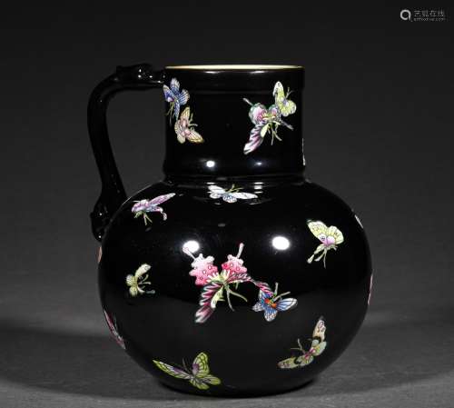 A QING DYNASTY FAMILLE ROSE BLACK GROUND BUTTERFLY GRAIN VAS...