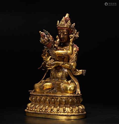 Bronze and gold plated joyful Buddha