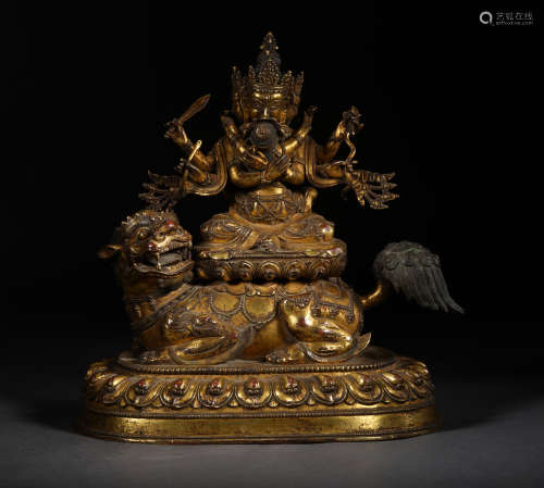 A MING DYNASTY GILT BRONZE DHARMAPALAS STATUE