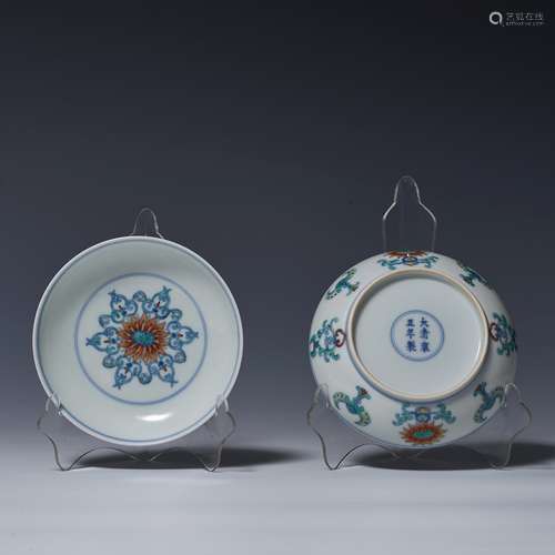 A pair of decorative plates with colorful gems and patterns ...