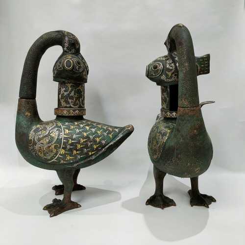 A PAIR OF WARRING STATES BRONZE GOLD AND SILVER INLAID WILD ...