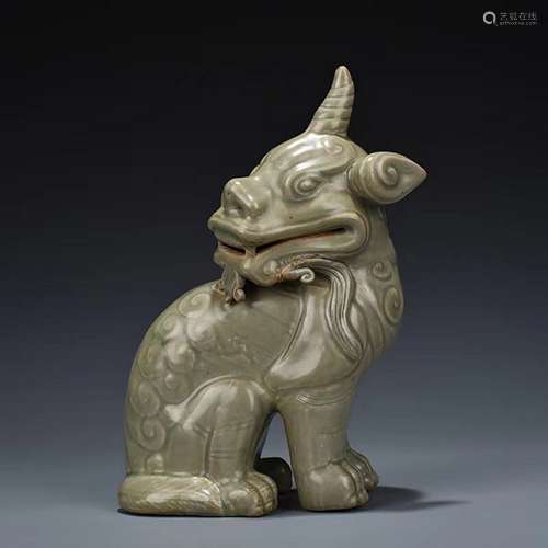 A FIVE DYNASTIES OLIVE-GREEN YUE KILN AUSPICIOUS BEAST UNICO...