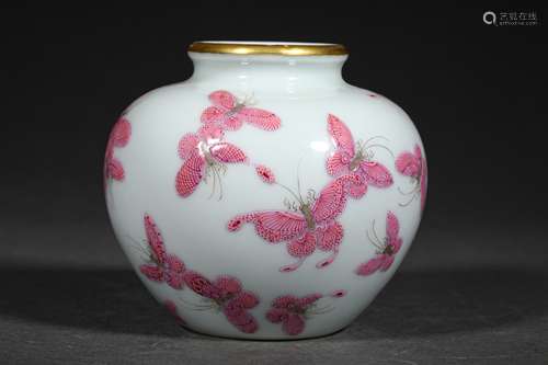 A QING DYNASTY CARMINE BUTTERFLY GRAIN JAR