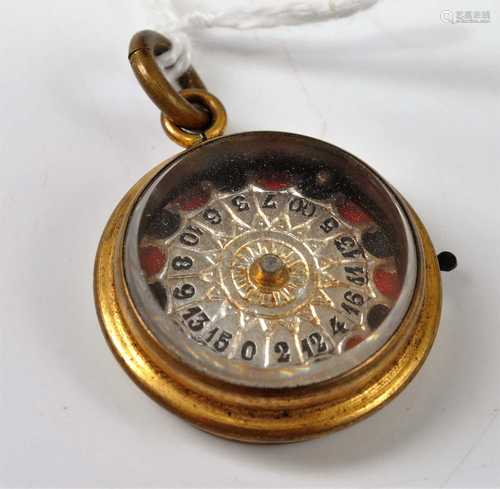 A gilt metal cased roulette wheel pendant, dia.23mm