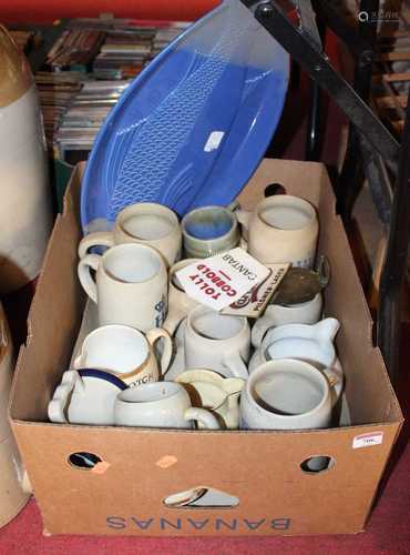 A collection of 20th century advertising steins and pitchers