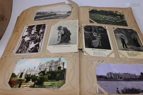 An early 20th century postcard album and contents, to includ...