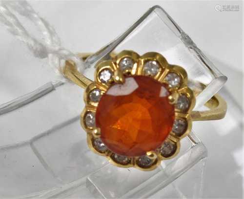 An 18ct gold, orange gemstone and diamond dress ring, the fo...