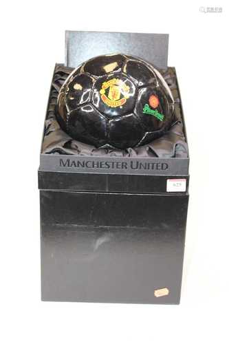 A Manchester United football, boxed