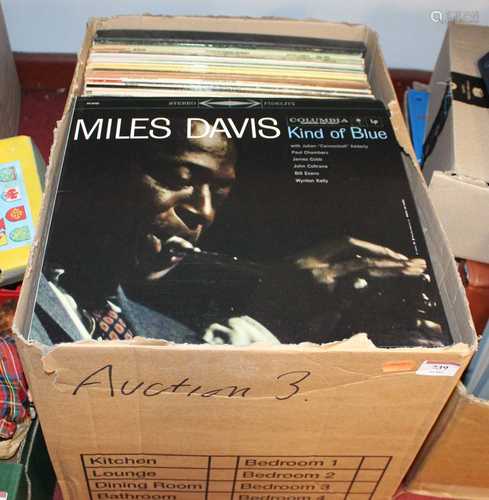 A box of LPs to include Miles Davis, John Coltrane, and othe...