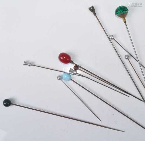 A collection of Edwardian and later steel hat-pins, with pas...