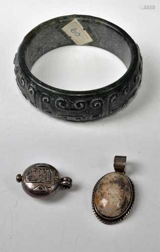 A Chinese carved hardstone bangle; together with a white met...