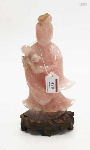 A Chinese carved rose quartz deity on hardwood stand, gross ...