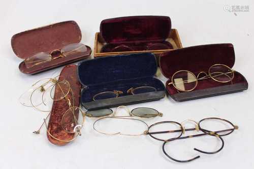 A collection of gilt metal framed spectacles, some with leat...