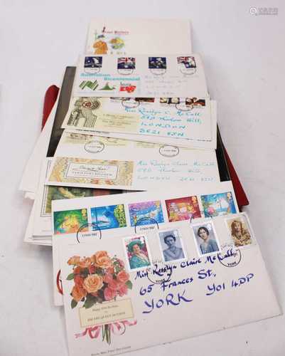 A collection of stamps and first day covers