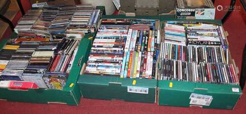 Four boxes of various CDs and DVDs and video games