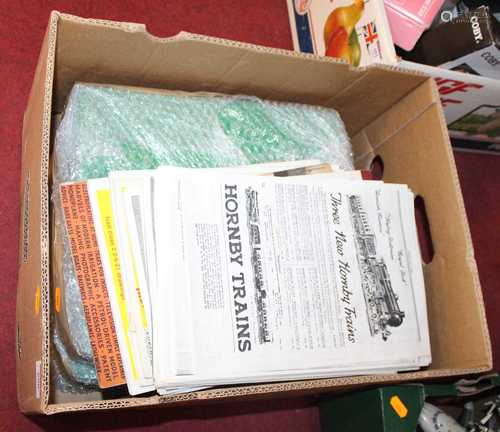 A box of magazines and ephemera relating to Hornby and model...