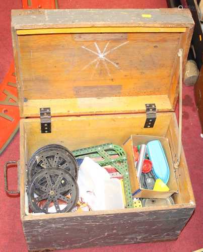 A pine trunk containing a collection of Meccano