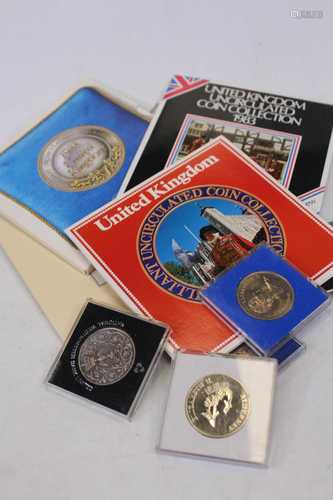 A small quantity of commemorative proof coins to include Roy...