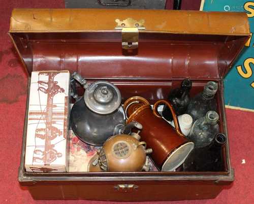 A tin trunk containing a collection of miscellaneous items t...