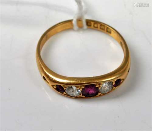 An Edwardian 18ct gold, ruby and diamond set five stone ring...