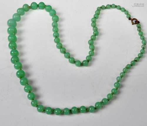 A beaded and graduated green hardstone necklace, 58cm