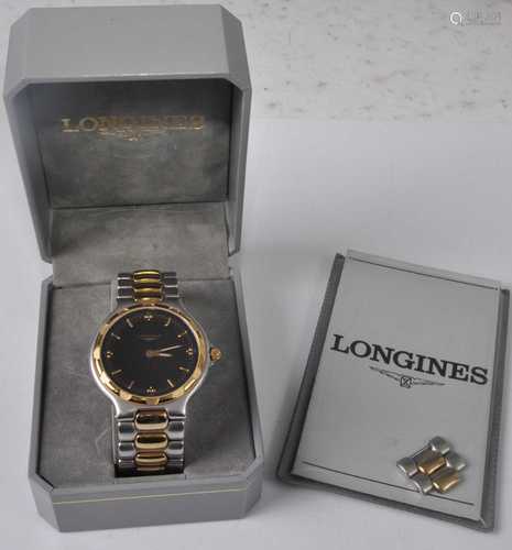 A gent's Longines Conquest steel and gilt metal bracelet wat...