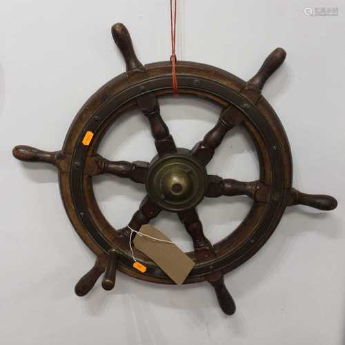 An early 20th century beech and brass mounted six spoke ship...