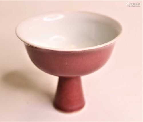 A Chinese export oxblood glazed stem cup of plain undecorate...